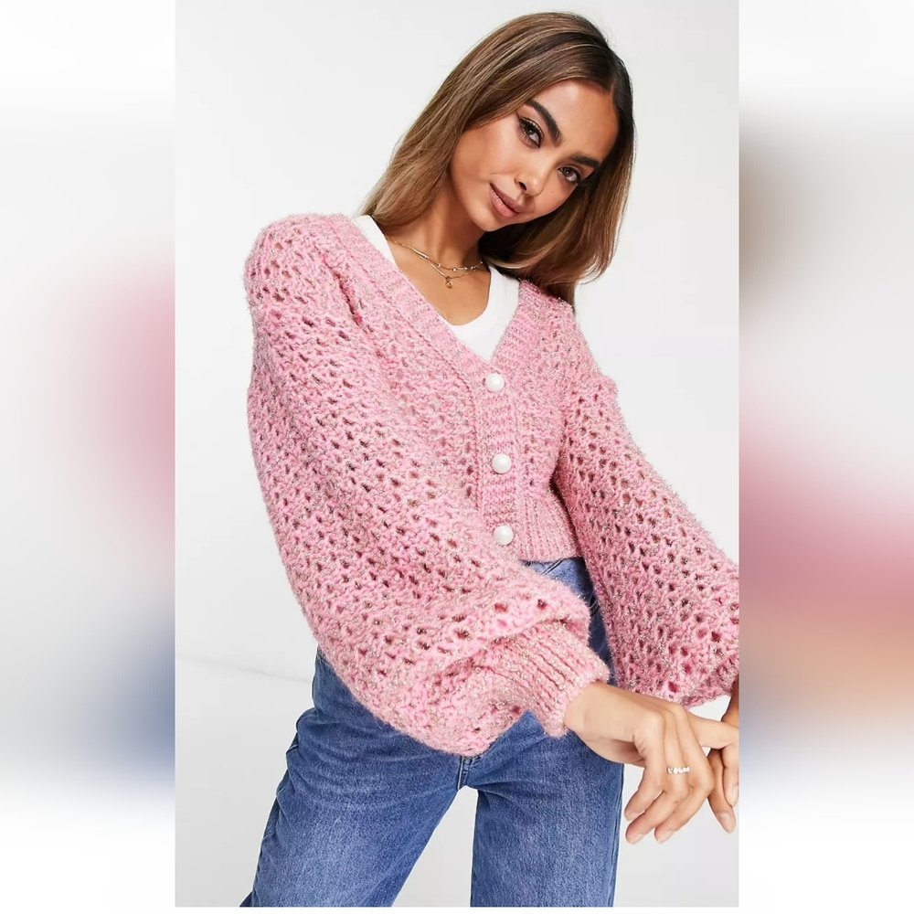 Metallic open knit cardigan with pearl buttons in pink.